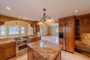 Kitchen with Knotty Elder Cabinets - 21561 Government Springs Rd Montrose, CO - Atha Team Realty