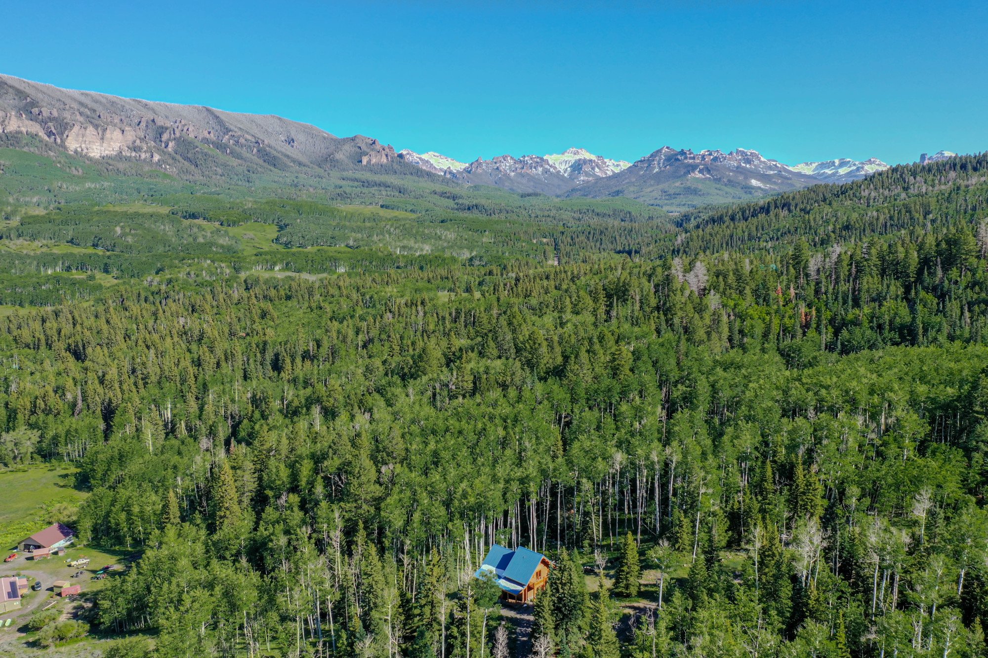 Aerial View of Cabin with Mountain Views - 84 Columbine Trail Cimarron Colorado 81220 - Atha Team Realty